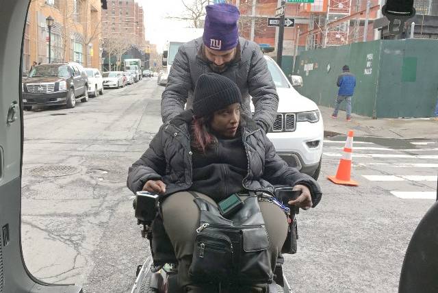 Valerie Joseph is part of an MTA pilot program that allows her to use a ride-sharing app to hail a wheelchair-accessible taxi on demand.